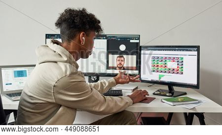 African American Stock Exchange Trader Meeting In Video Call With Teammate. Working From Home Concep