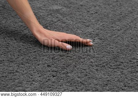Woman Touching Soft Grey Carpet, Closeup View