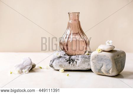 Beautiful Pink Transparent Bottle Of Perfume With Flowers