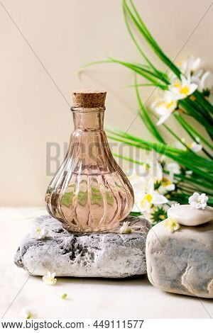 Beautiful Pink Transparent Bottle Of Perfume With Flowers