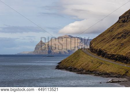 View Of The Road Along The Coast On The Island Of Vagar. Mountain Landscape. Bour On Vagar Island. F