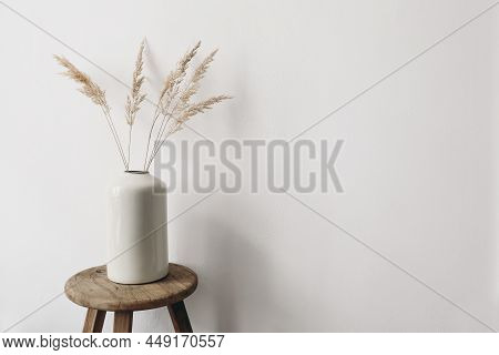 Modern Summer, Fall Still Life Photo. Grey Ceramic Vase With Dry Festuca Grass On Old Wooden Stool. 