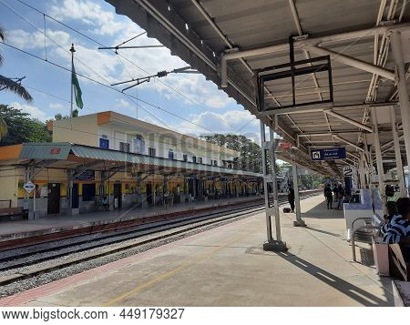 Closeup Of Mandya Railway Station And Train Moving From One Place To Another, Waiting People In The