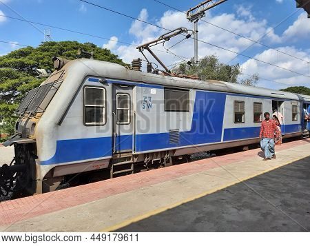 Closeup Of Mandya Railway Station And Train Moving From One Place To Another, Waiting People In The
