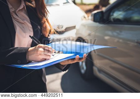 Woman Notify Insurance Agents Is Writing An Accident Car Crash Report, To People And Transportation 