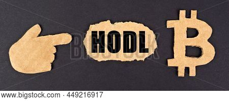 Business And Technology Concept. On A Black Background, Cardboard Figures Of The Bitcoin Symbol And 