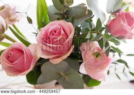 Beautyful Pink Spring Flowers With Eukalyptus On Bright Background And Short Depth Of Field