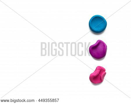 Three Color Modeling Clay Plasticine Finger Textured Flatten And Crumpled Balls Or Lumps Isolated On