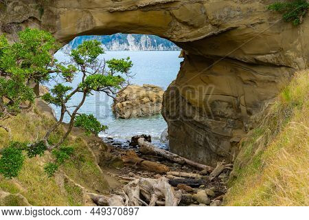 Blue Water Of Tolaga Bay Through Hole In The Wall Tourist Destination And Landmark On East Coast New