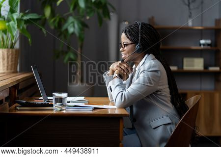 Young Friendly Black Woman Remote Call Center Worker In Headset With Microphone Broadly Smiling Whil