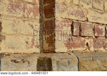 A Brick Wall In The Afternoon Sun