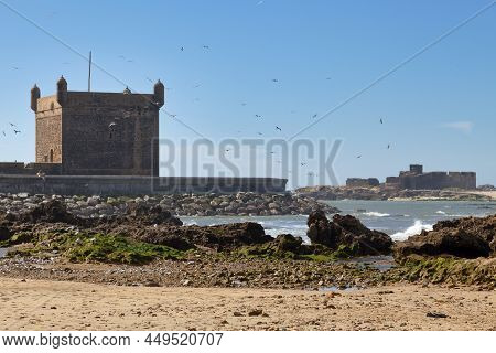 The Harbour Scala With Behind, The Ruins Of A Fort On Essaouira's Small Island.