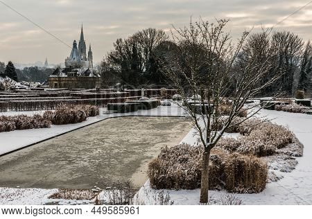 Panoramic View Over The Stuyvenberg City Park With Frozen Ponds, Snowy Reeds And Meadows