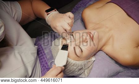 Woman Cleansing Facial In Spa Salon. Water Oxygen Face H2o2 Small Bubble Facial Rf Lifting Equipment