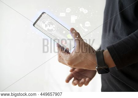 Man\'s Hands Use Futuristic Glass Phone With Latest Modern Holographic Technology. Concept Of: Futur