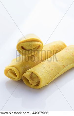 Stuffed Pancakes Or Crepes Rolls With Chicken Meat And Cheese. Traditional Russian Shrovetide Maslen