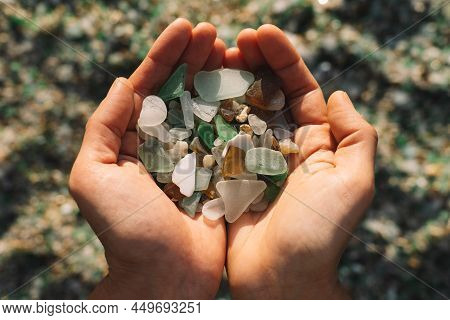Woman Hands Holding Colored Crystals Eroded By The Sea In The Beach Of The Crystals In The Silleiro 
