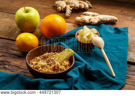Couscous Masfouf With Dried Fruits And Nuts In A Plate On A Blue Napkin On A Wooden Table Next To Fr