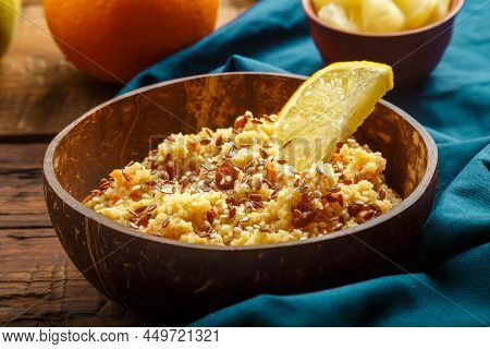 Couscous Masfouf With Dried Fruits And Nuts On A Blue Napkin. Horizontal Photo