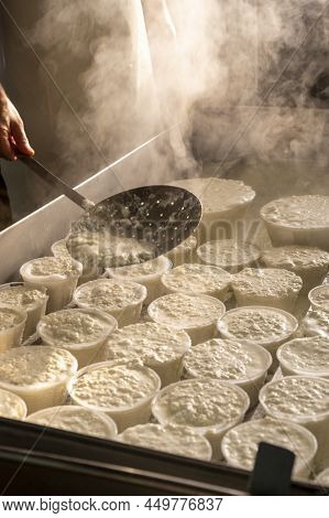 Process Of Making Fresh White Soft Ricotta Whey Cheese On Small Cheese Farm In Parma, Italy