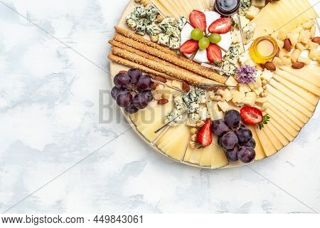 Antipasto Platter, Antipasto Cheese Board Of Various Types Of Soft And Hard Cheese. Spanish Manchego