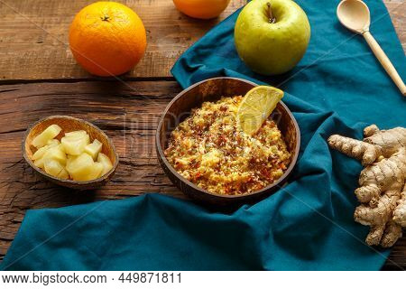 Couscous Masfouf With Dried Fruits And Nuts In A Plate On A Blue Napkin On A Wooden Table Next To A 