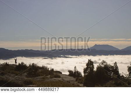 Landscape Showing The Silhouette Of A Person Over A Fog Layer In A Mountain In Tavertet Town In Cata
