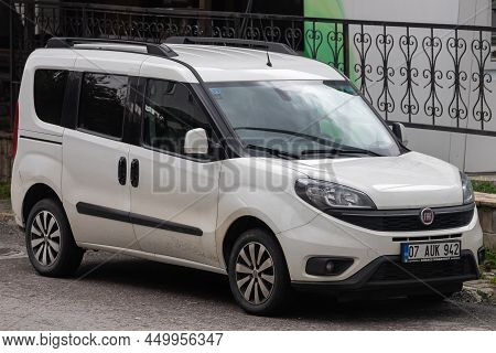 Side, Turkey - February 02 2022:  White Fiat Doblo  Is Parked  On The Street On A Warm Summer Day Ag