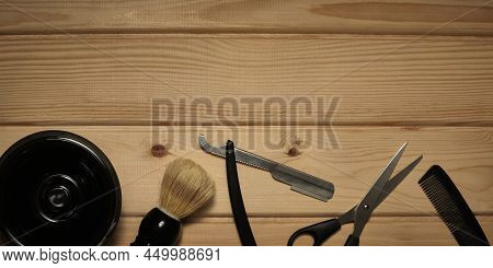 Barber Or Hairdresser Set. Shears, Comb, Straight Razor, Shaving Bowl And Shaving Brush At Wooden Su
