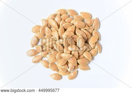 Pumpkin Seeds On White Background. Close Up Top View