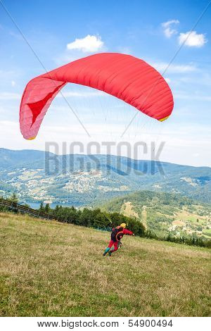 Zar mountain, Poland  - AUGUST 1: Single paraglider starts from slope of Zar mountain in Beskid