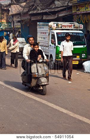 Vespa Rider With Child On Early Morning