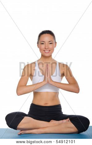 Asian Sitting In The Lotus Position And Smiling