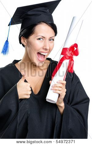 Graduating student with the diploma and in the black academic gown thumbs up, isolated on white
