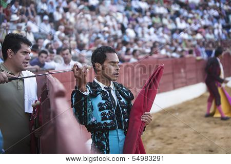 Bullfighter Luis Bolivar picking up the sword to kill the bull in the Bullring of Baeza