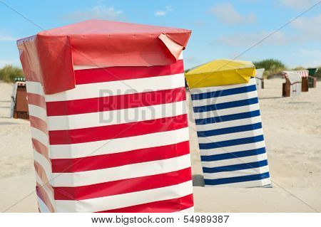 Typical striped chairs on German Borkum at the beach