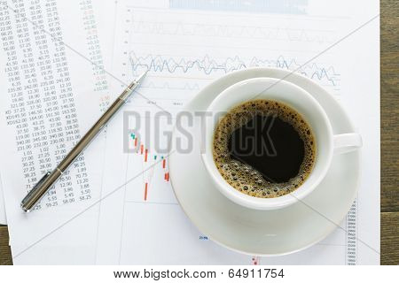 Coffice cup and financial documents