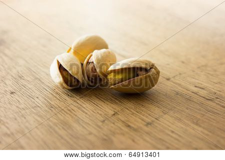 Pistachio nuts on a old kitchen desk. 