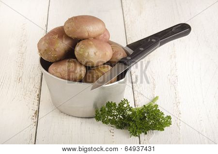 Raw Potato With Parsley And Knife