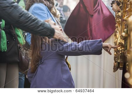Girl Tries To Touch The Skirt Of The Throne To Have Good Luck, Popular Tradition In Andalusia, Easte
