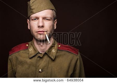 Russian soldier smoking cigarette