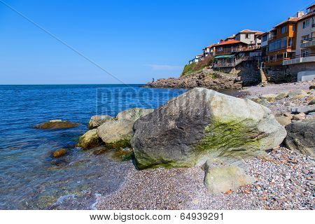 Seascape Old Town With Rocks In The Foreground