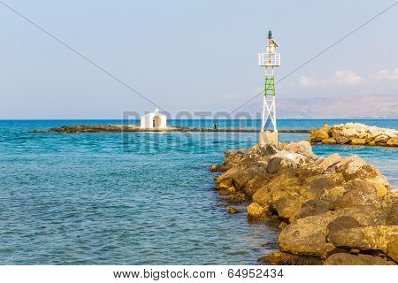 Old Venetian Lighthouse At Harbor In Crete, Greece. Small Cretan Village Kavros. Travel Background