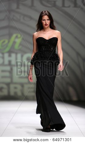 ZAGREB, CROATIA - MAY 09: Fashion model wearing clothes designed by Avaro Figlio on the Zagreb Fashion Week on May 09, 2014 in Zagreb, Croatia.