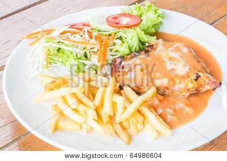 Grilled Chicken Steak With French Fries And Vegetables