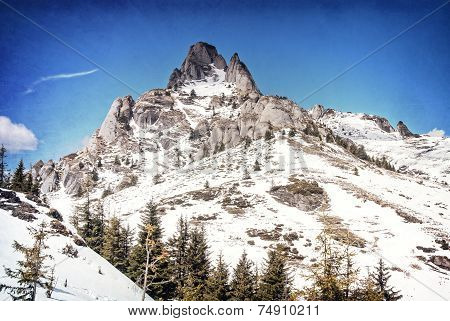 Snowy peaks of a mountain in winter