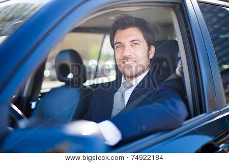 Portrait of a man driving a car