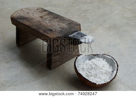 half of coconut shell with coconut grater 2