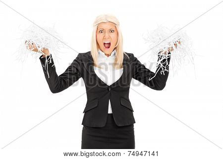 Outraged businesswoman holding a shredded document isolated on white background