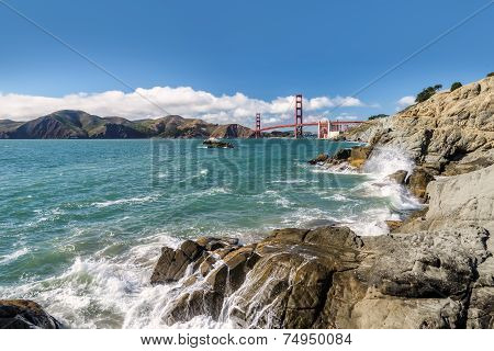 Sea, rocks and bridge Golden Gate.
